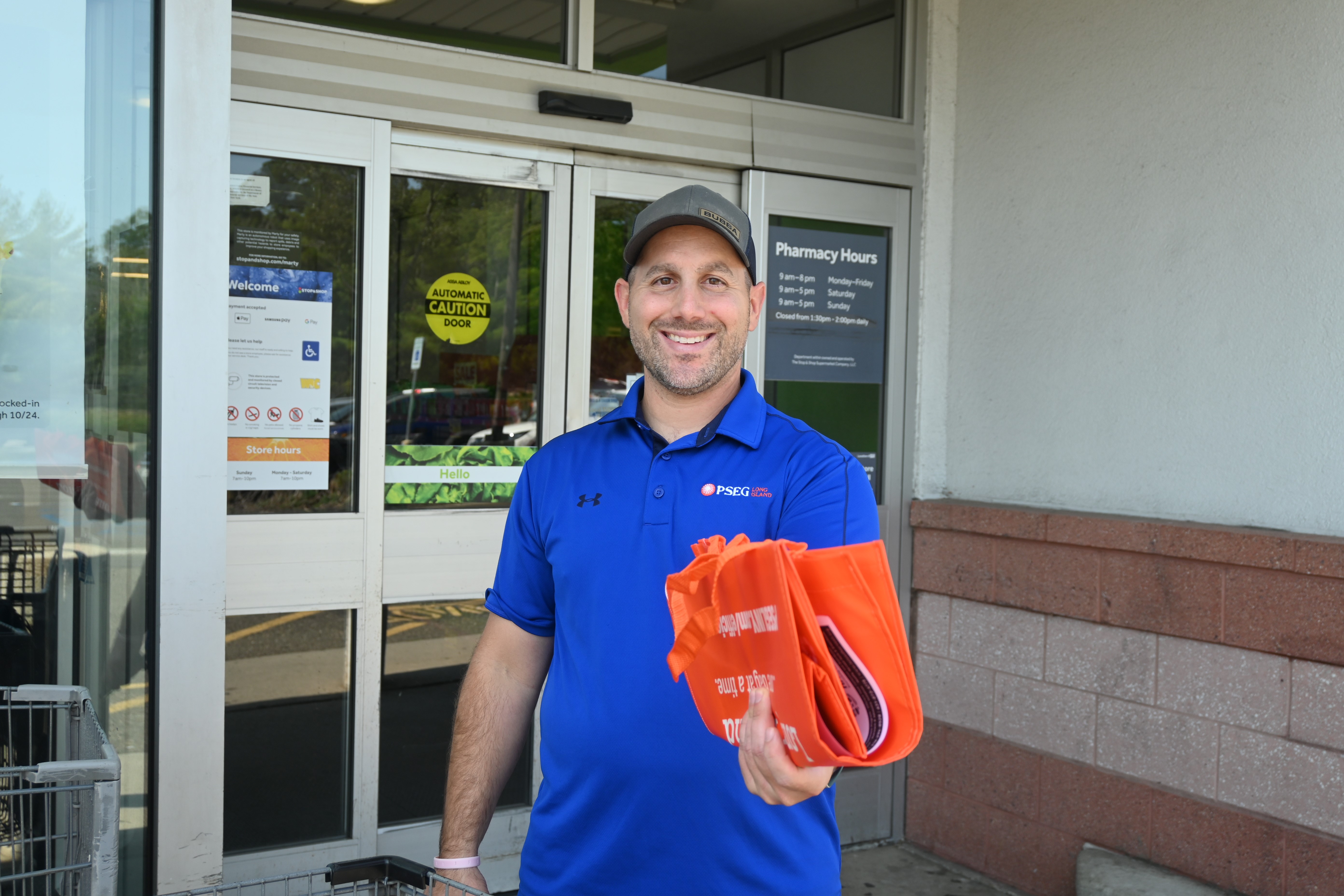 Rob Massaro, of West Islip, and his colleagues at PSEG Long Island collected food, personal care items and monetary donations as part of PSEG Long Island’s Power to Feed Long Island collection initiative in West Babylon Friday, Sept. 15. 