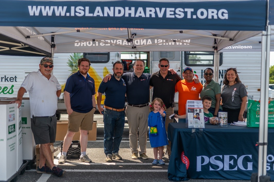 PSEG Long Island interim President and COO Dave Lyons (fifth from l.) joined employee-volunteers and Island Harvest at PSEG Long Island’s Power to Feed Long Island collection drive in Carle Place on July 26.