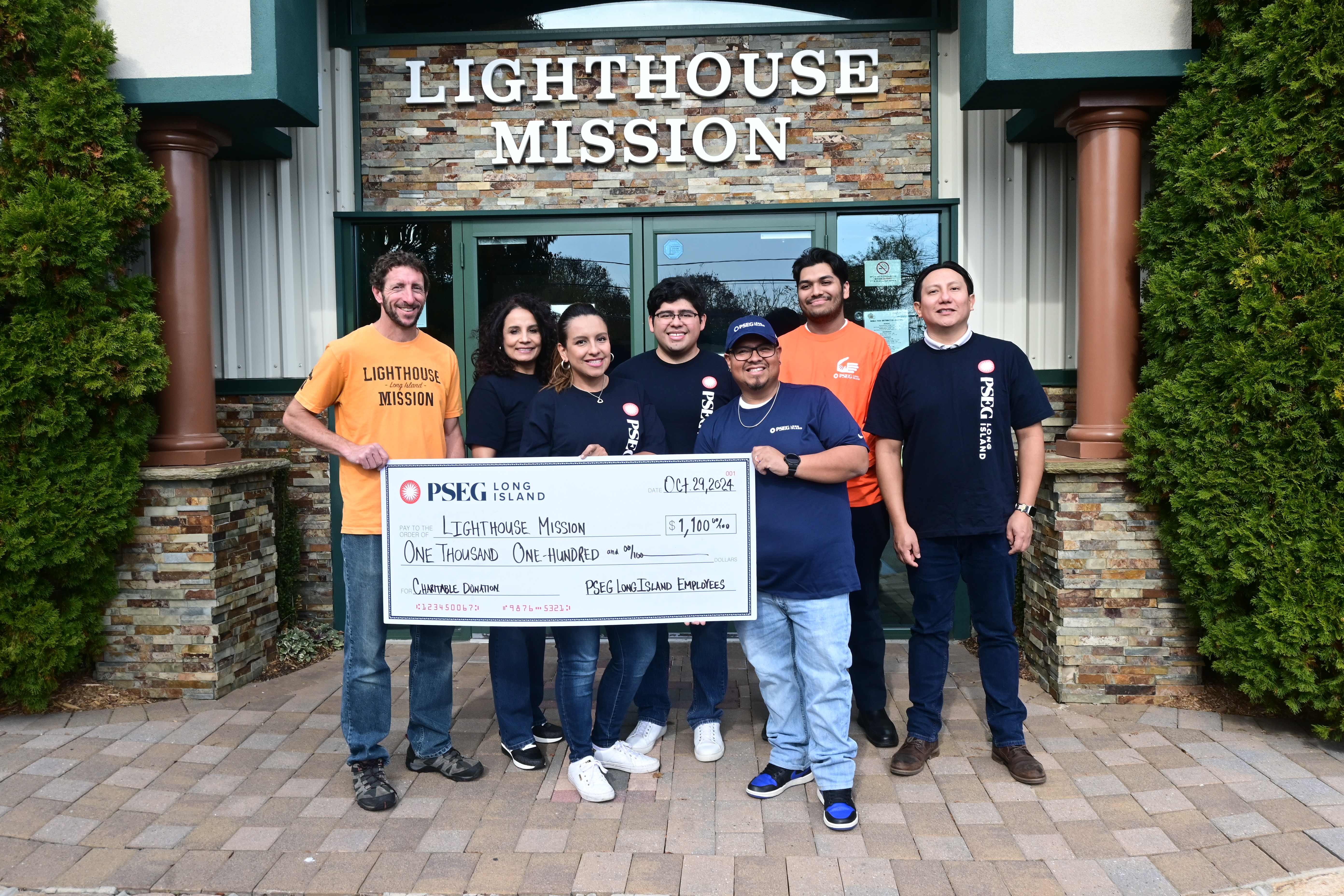 Pictured (l-r) are Pastor Michael Caiazzo of Lighthouse Mission with Johanna Villamil, Mariela Espinosa, Lesther Reyes-Mora, Norberto Lopez, Charles Wrizar and German Encalada of PSEG Long Island.